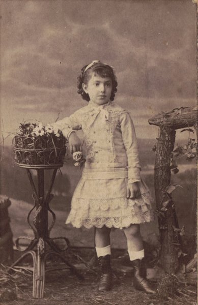 Portrait of a young girl in white dress