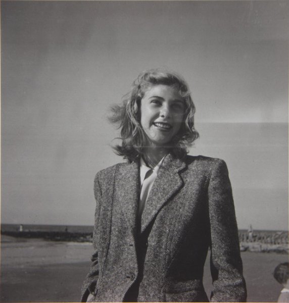 Untitled (young woman in a tweed jacket on a beach)