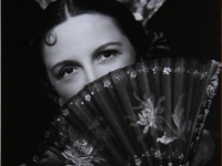Untitled (portrait of a woman in Spanish flamenco costume covering her face with a fan) 
