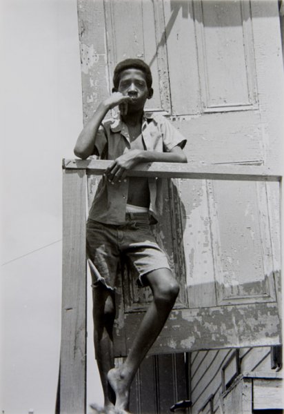 Untitled (Portrait of a teenage boy standing on a balcony)