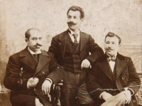 Studio portrait of three gentlemen