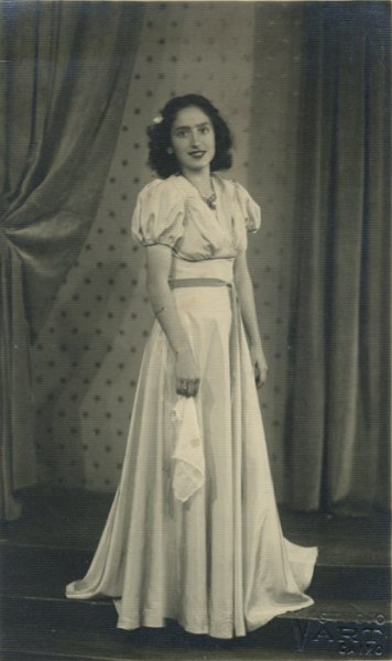 untitled (Studio portrait of a bridesmaid with handkertchief and a belt)