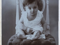 Untitled (portrait of a child on an ornate chair)